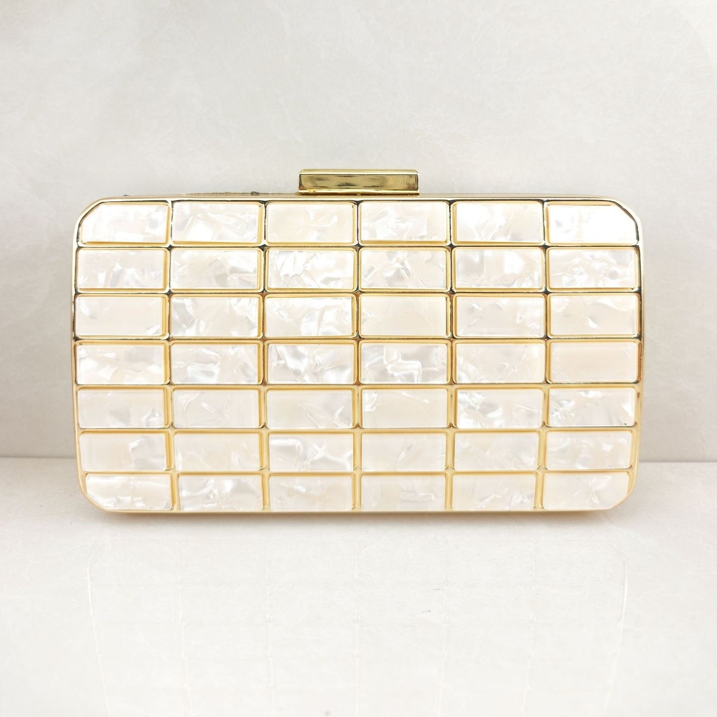 Acrylic evening clutch purse in champagne with lock closure