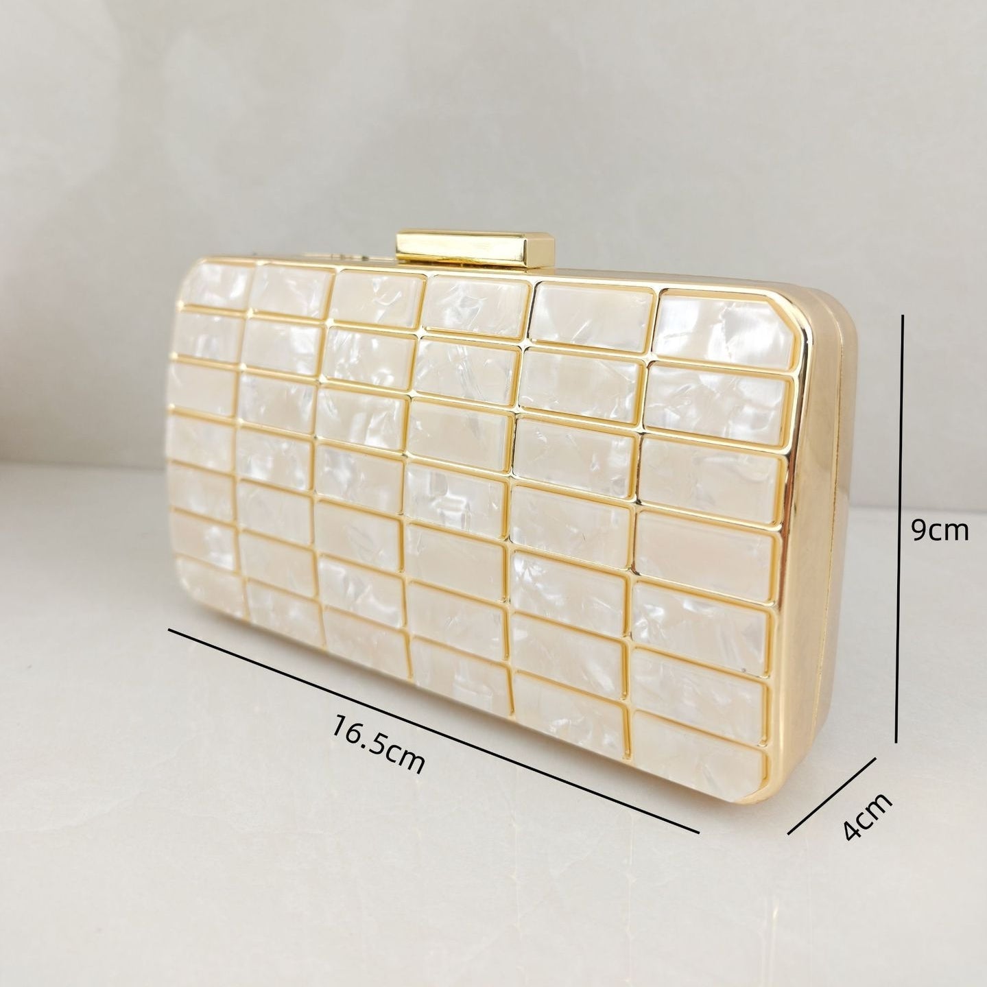 Acrylic evening clutch purse lock closure detail