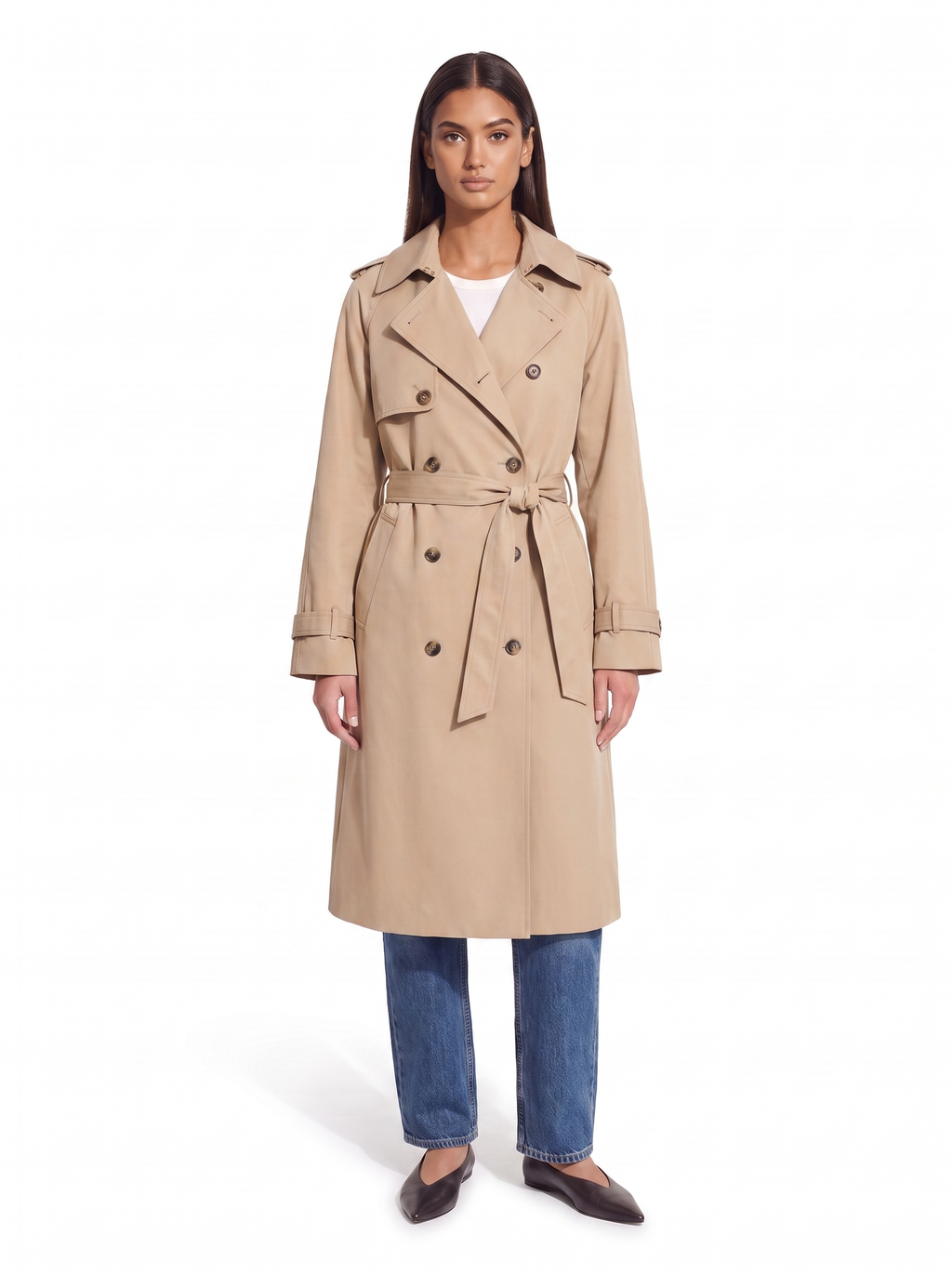 Beige double breasted trench coat worn by model, front view