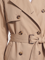 Trench coat buttons and belt close up detail