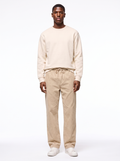 Beige wide leg corduroy pants worn by model, front view
