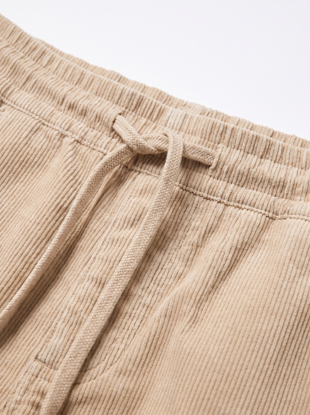 Drawstring waistband and corduroy wale close up detail