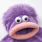 Monster onesie hood detail with googly eyes and furry mouth