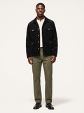Black corduroy cargo jacket with flap pockets, front view on model