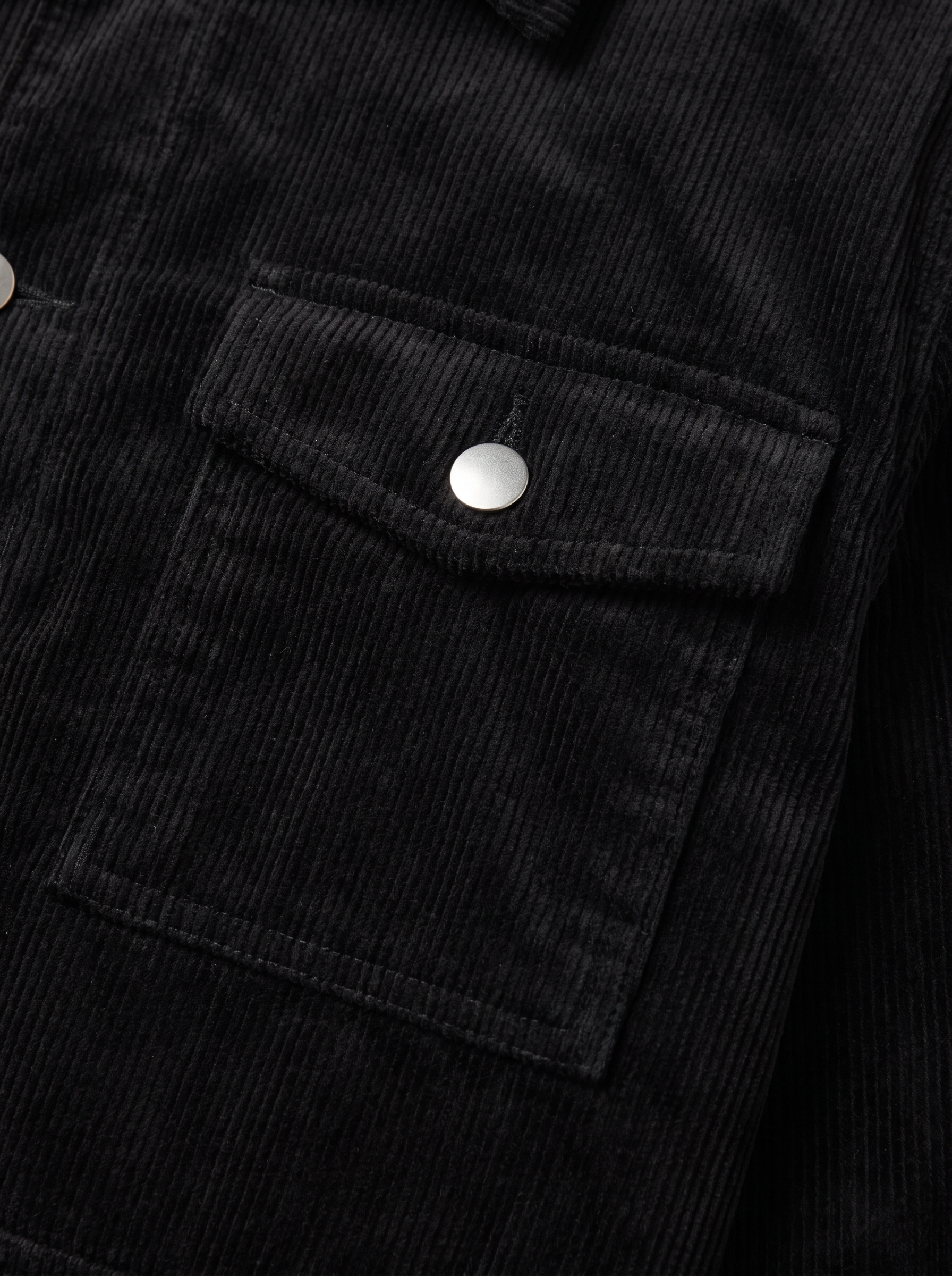 Close up of flap pocket and corduroy wale texture