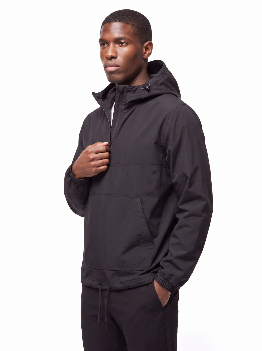Black anorak three quarter view showing relaxed fit