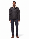 Black waxed canvas jacket with sherpa collar, front view on model