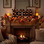 BOO marquee letters glowing on a decorated mantel