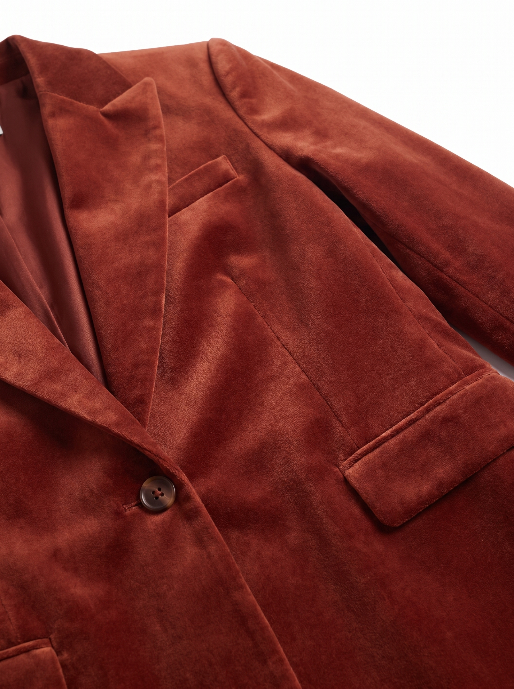 Velvet blazer notched lapel and single button close up