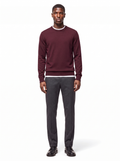 Deep burgundy crew neck sweater worn by model, front view
