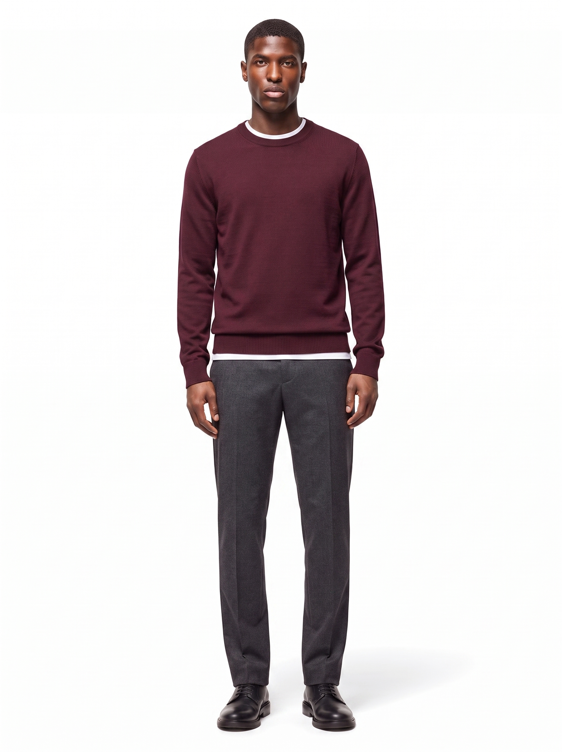 Deep burgundy crew neck sweater worn by model, front view
