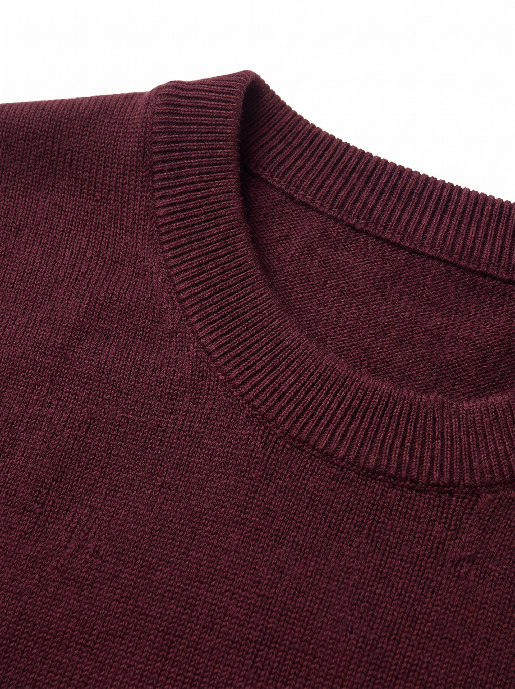Close up of ribbed collar and knit on burgundy sweater