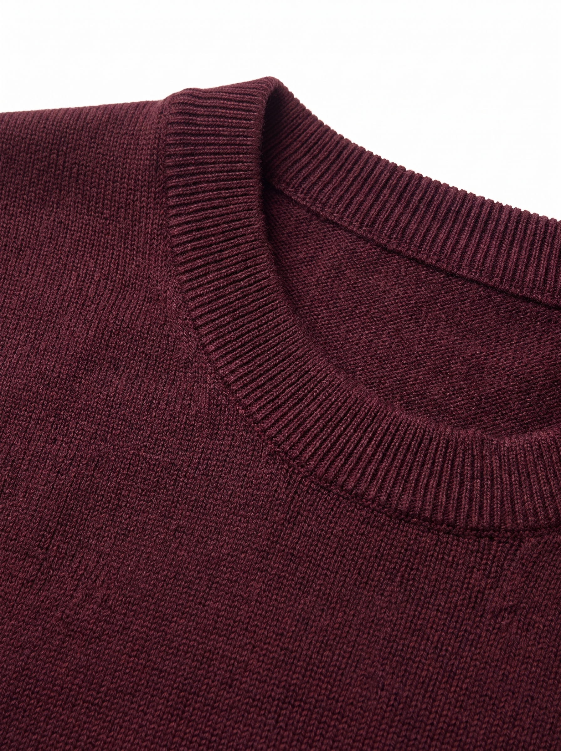 Close up of ribbed collar and knit on burgundy sweater
