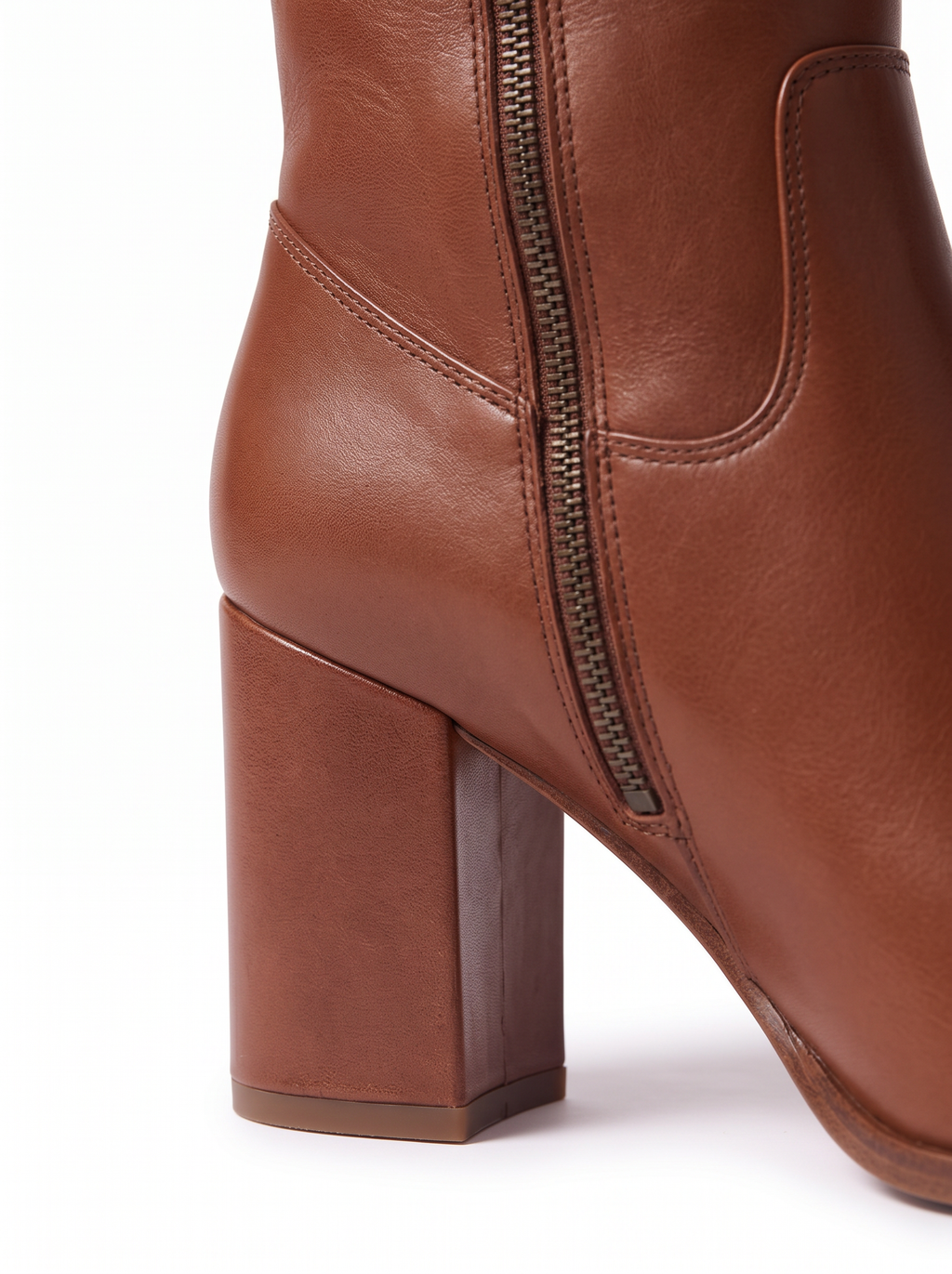 Riding boot side zipper and block heel close up detail