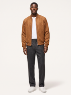 Cognac faux suede bomber jacket with ribbed collar, front view on model