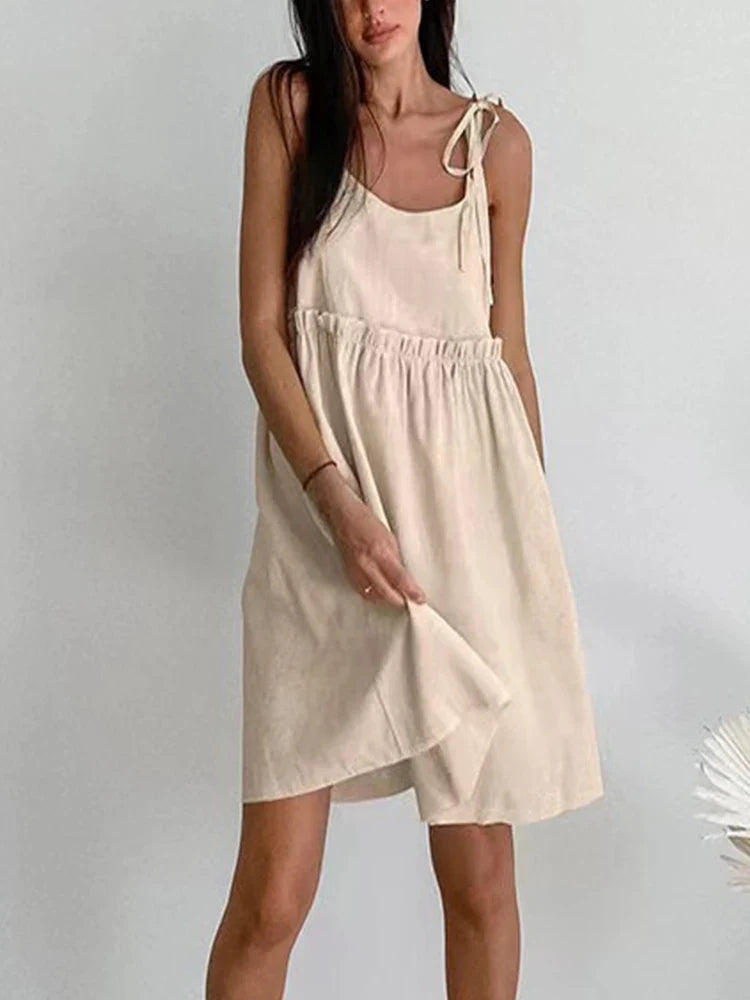 Cotton linen backless vest mini dress in tan, side view