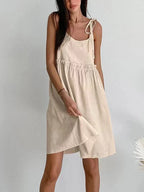 Cotton linen backless vest mini dress in tan, side view