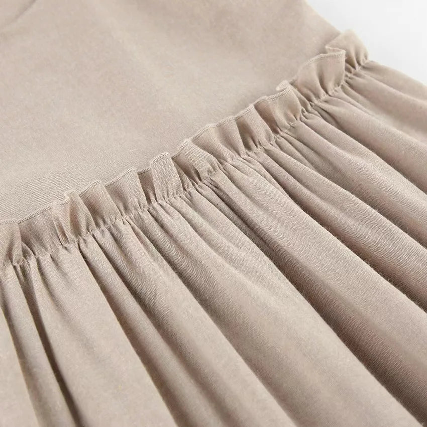 Close up of cotton linen fabric on vest mini dress