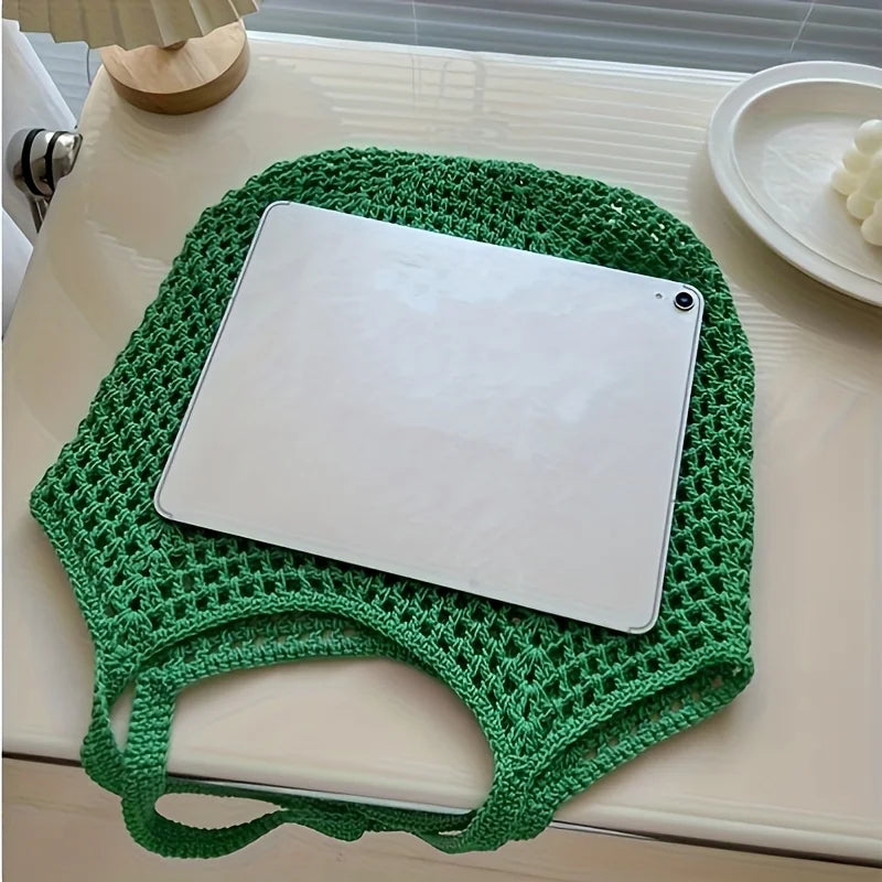 Crochet mesh tote bag carried on the shoulder
