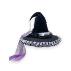 Crooked ruched black witch hat with bow on a white background
