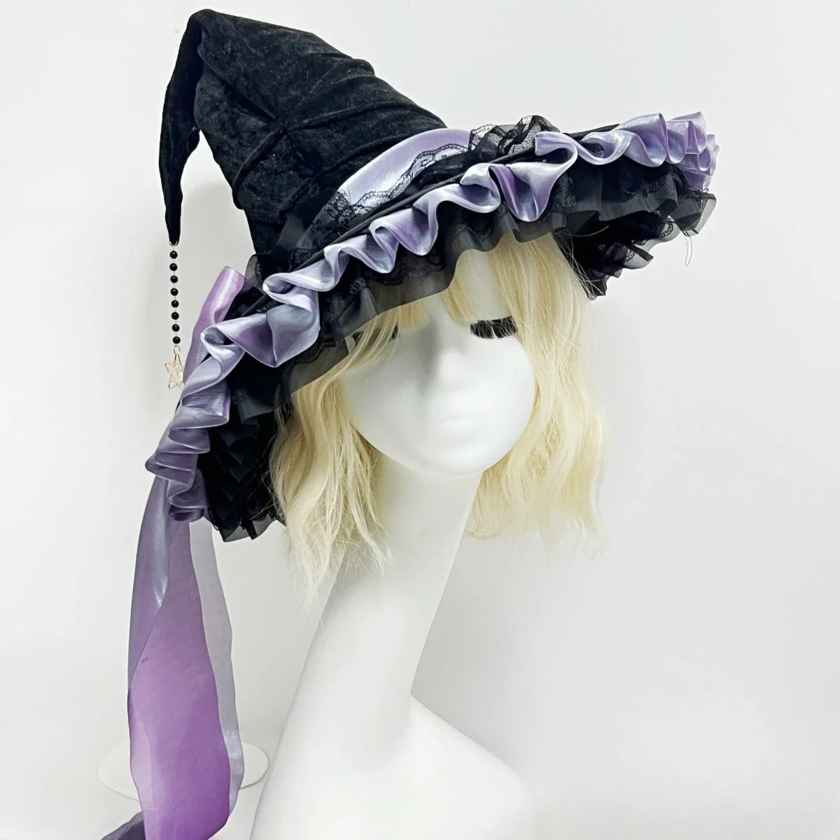 Large black witch hat with ruched crown and statement bow