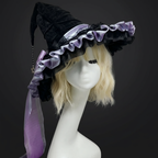 Close-up of the ruched texture and bow on the witch hat