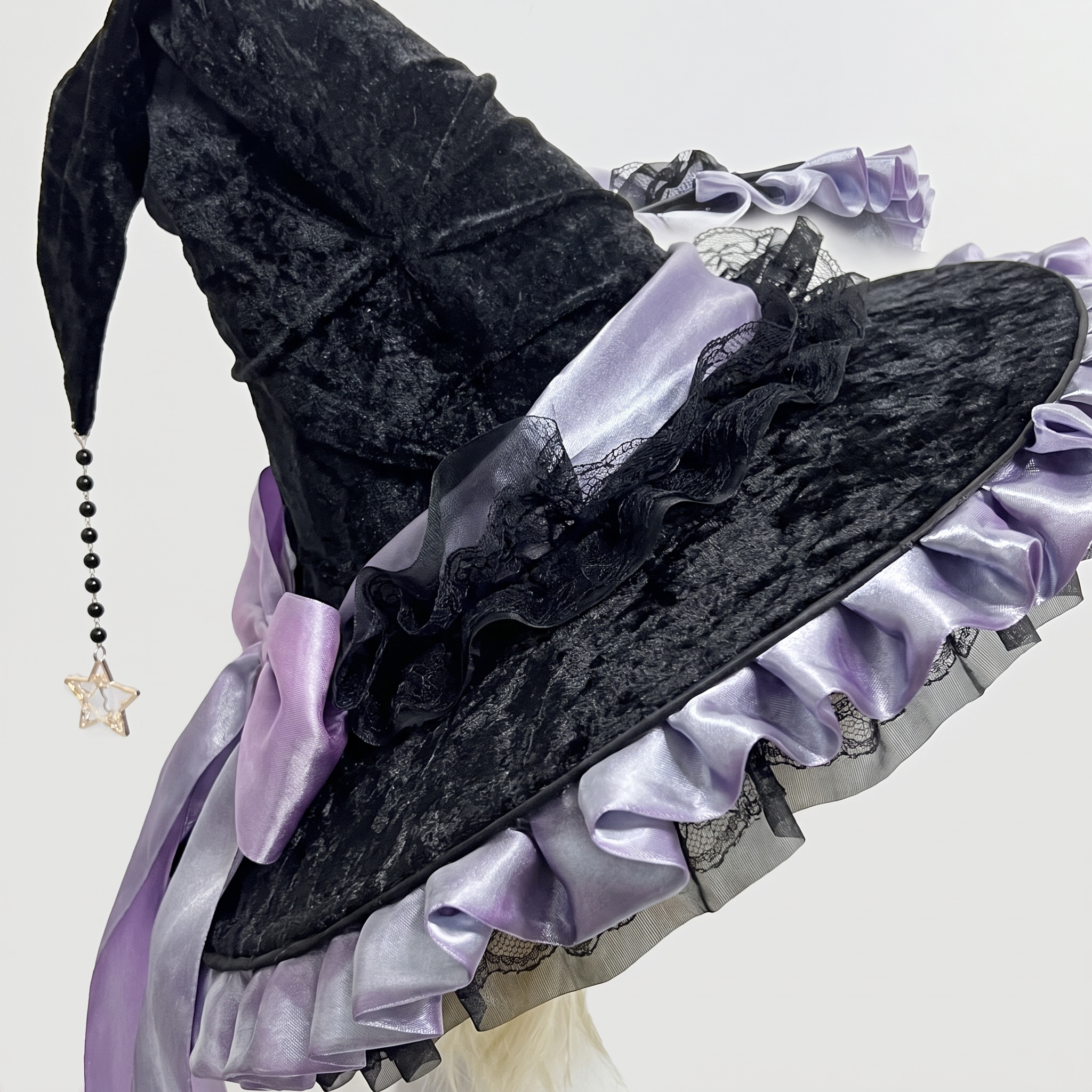Black witch hat styled with a Halloween costume look