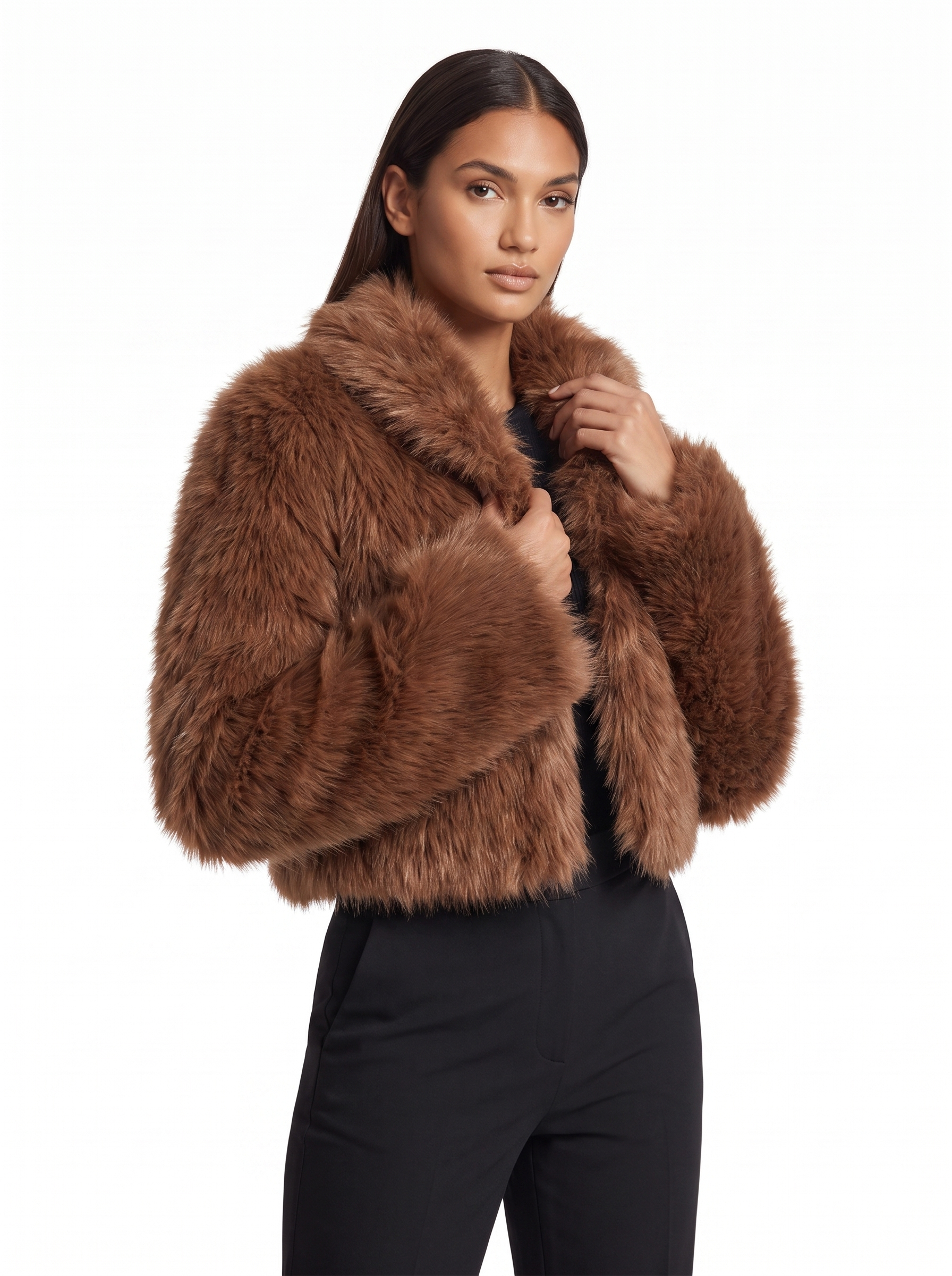 Three quarter view showing cropped fit of faux fur jacket