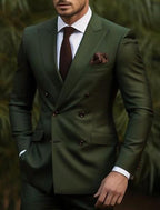 Dark green double breasted men's suit, full front view with peaked lapels