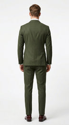 Side profile of dark green double breasted suit