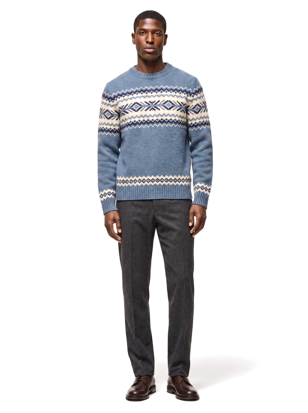 Fair Isle crew neck sweater in dusty blue worn by model, front view