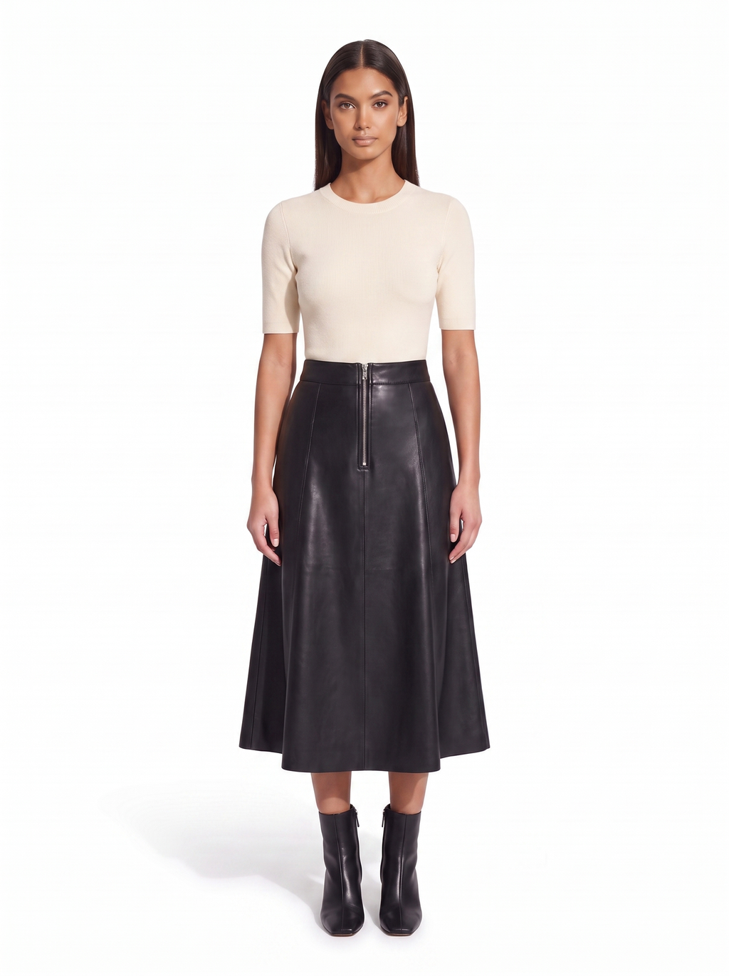Black faux leather flared midi skirt worn by model, front view