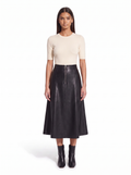 Black faux leather flared midi skirt worn by model, front view