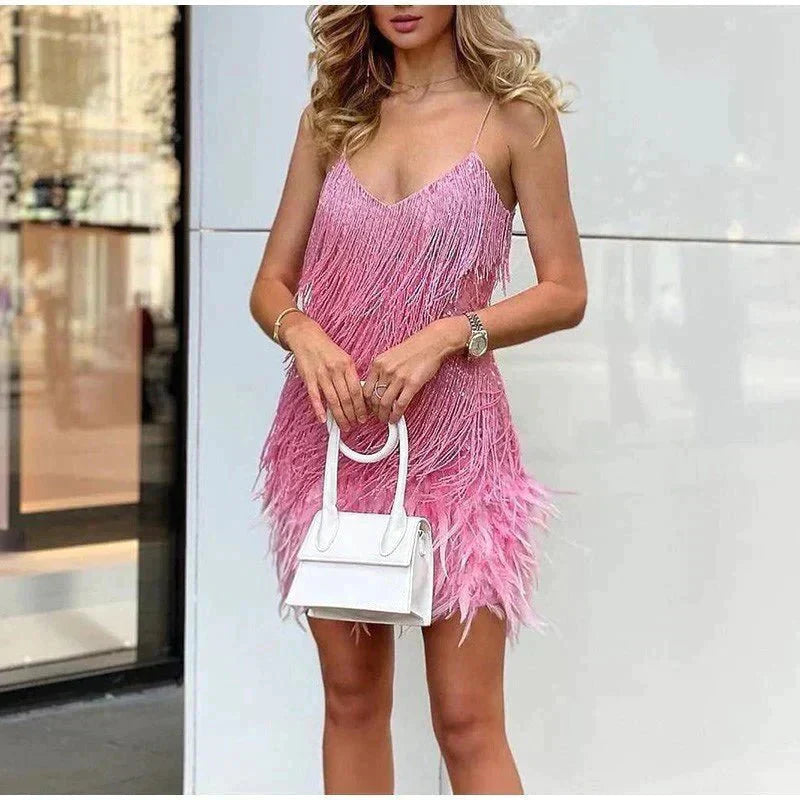 Feather-trim mini dress styled for an evening out