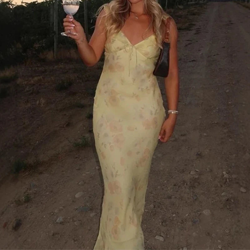 Back view showing the open back of the sling dress