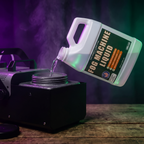 Pouring fog machine liquid into a fog machine tank