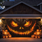 Halloween garage banner above a decorated yard at night