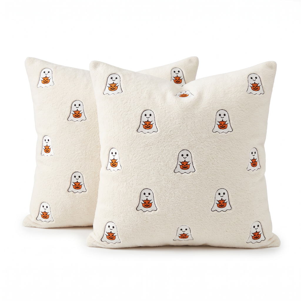Two ivory throw pillow covers with ghosts hugging pumpkins