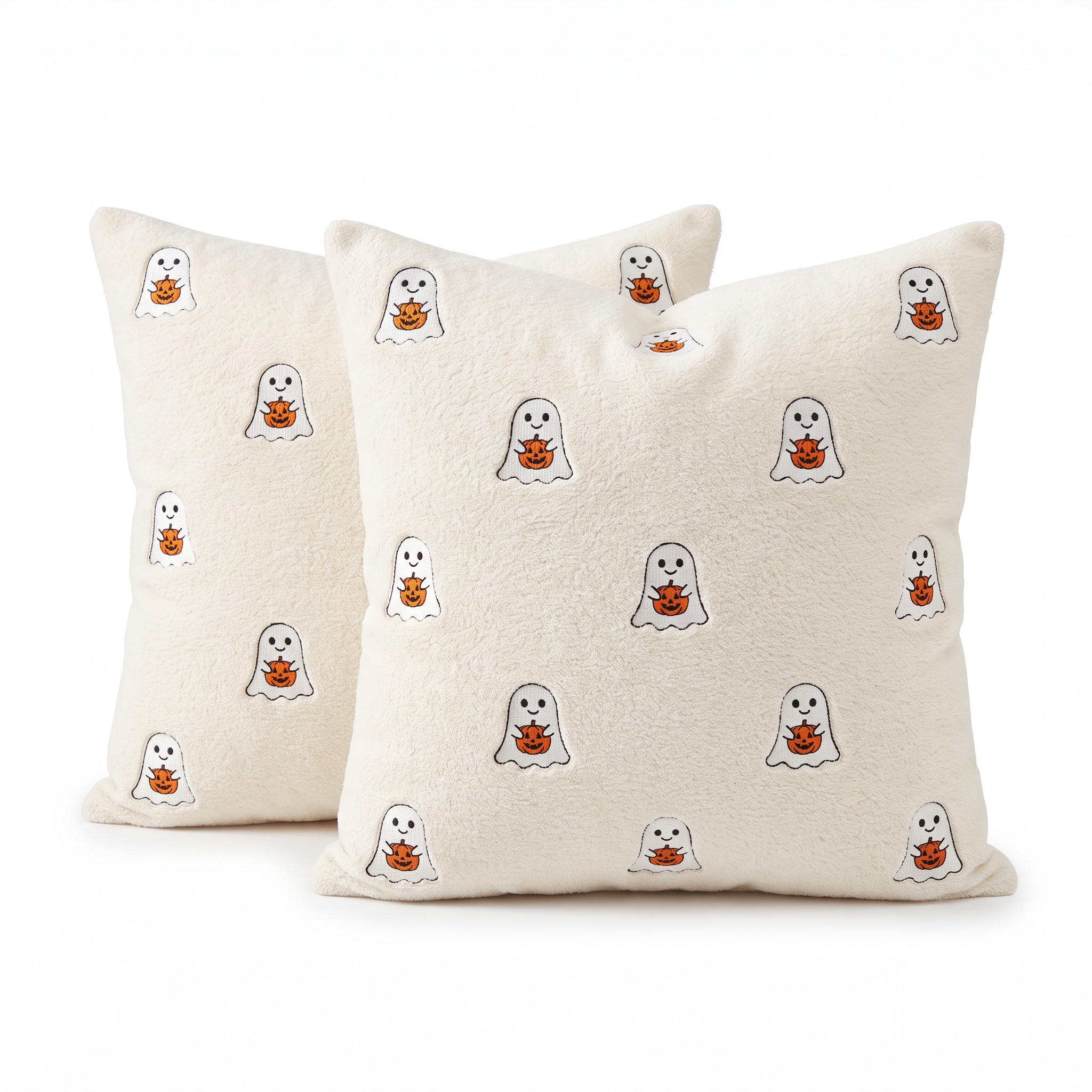 Two ivory throw pillow covers with ghosts hugging pumpkins
