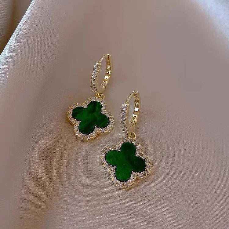 Gold-tone four-leaf clover earrings in green