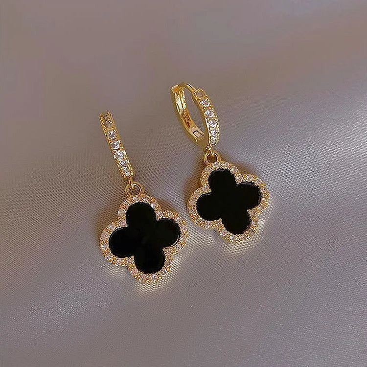 Gold-tone four-leaf clover earrings in black