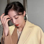 Gold-tone clover earrings, product view