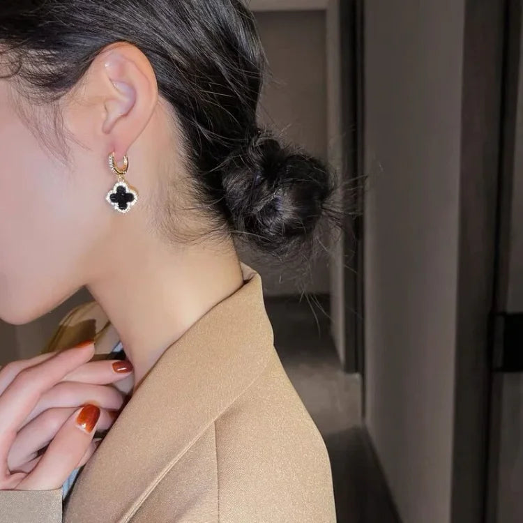 Gold-tone clover earrings, product view