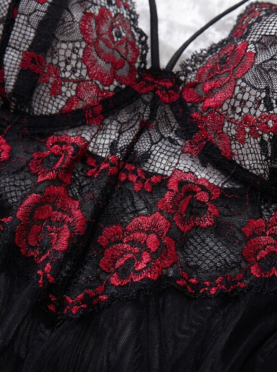 Close up of red rose lace detail on the black semi sheer nightgown