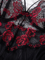 Close up of red rose lace detail on the black semi sheer nightgown