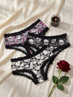 Gothic skull lace panties fanned out in a flat lay