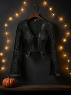 Gothic spider web V neck top on a hanger