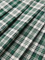 Check pattern and knife pleats close up detail