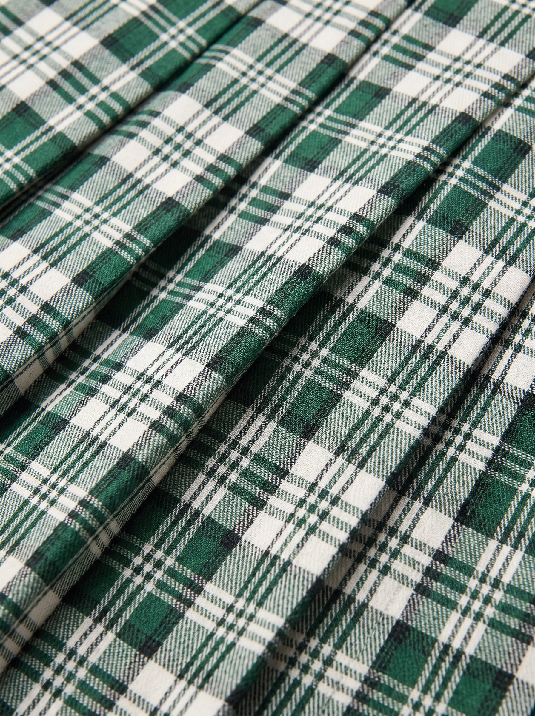 Check pattern and knife pleats close up detail