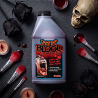 Fake blood in an SFX makeup flat lay with brushes and a skull